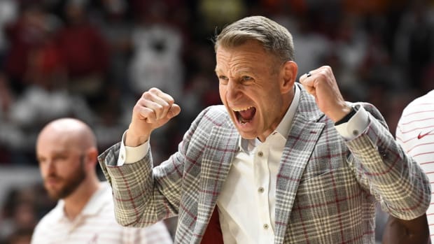Alabama head coach Nate Oats cheers on his team as they play Tennessee at Coleman Coliseum.