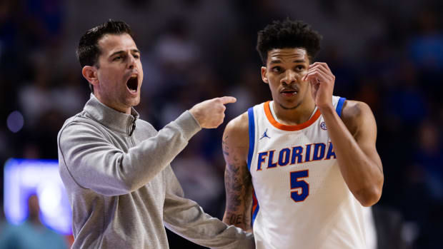 Feb 28, 2024; Gainesville, Florida, USA; Florida Gators head coach Todd Golden screams with Florida Gators guard Will Richard (5) during the second half at Exactech Arena at the Stephen C. O'Connell Center. Mandatory Credit: Matt Pendleton-USA TODAY Sports  
