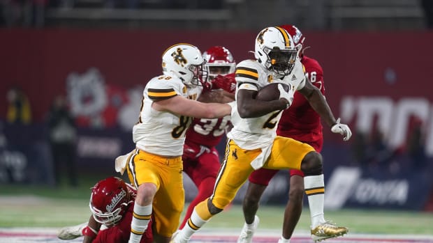 Nov 25, 2022; Fresno, California, USA; Wyoming Cowboys running back Titus Swen (2) runs the ball against the Fresno State Bulldogs in the fourth quarter at Valley Children's Stadium. Mandatory Credit: Cary Edmondson-USA TODAY Sports  