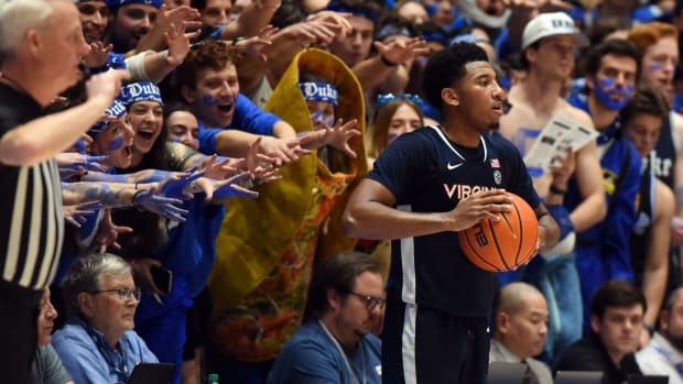 Virginia Cavaliers guard Reece Beekman (2) is harassed by Duke students as he attempts to inbound the ball during the second half at Cameron Indoor Stadium.