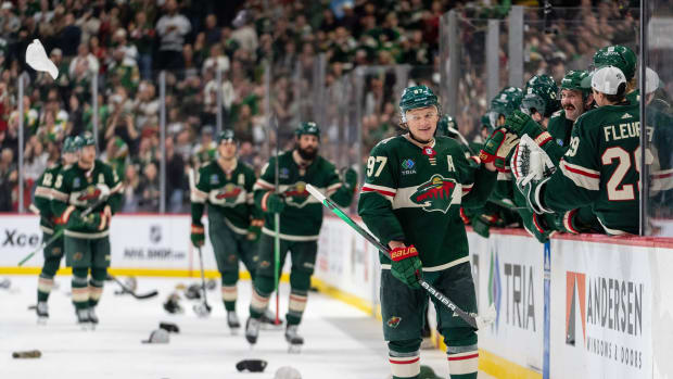Mar 3, 2024; Saint Paul, Minnesota, USA; Minnesota Wild left wing Kirill Kaprizov (97) celebrates his third goal of the game as hats rain down on the ice in the third period against the San Jose Sharks at Xcel Energy Center.