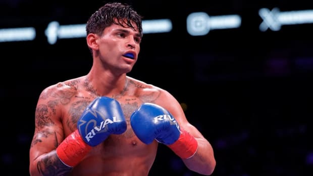 Ryan Garcia looks on while facing Oscar Duarte during their welterweight fight at Toyota Center in Houston, Texas. Ryan Garcia reaches a new low by staging his own death in order to promote pay-per-view. CARMEN MANDATO/GETTY IMAGES.
