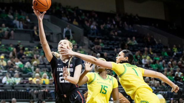 Oregon forward Kennedy Basham fouls Stanford forward Cameron Brink as the Oregon Ducks host the No. 4 Stanford Cardinal Saturday, March 2, 2024, at Matthew Knight Arena in Eugene, Ore.