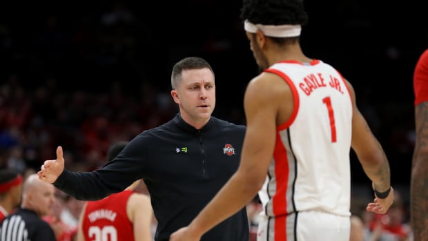 Ohio State Buckeyes head coach Jake Diebler congratulates guard Roddy Gayle Jr. (1) during the first half against the Nebraska Cornhuskers at Value City Arena.