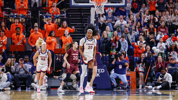 Camryn Taylor celebrates after scoring a basket during the Virginia women's basketball game against Virginia Tech at John Paul Jones Arena.