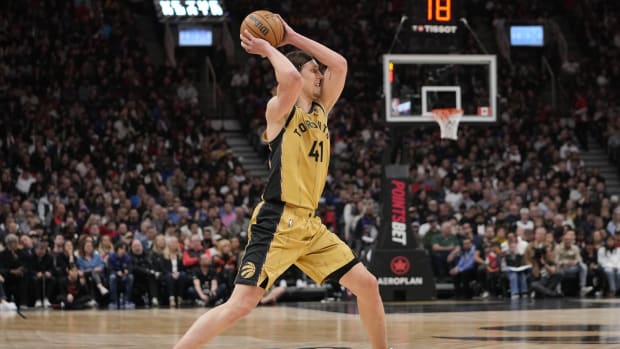 Mar 1, 2024; Toronto, Ontario, CAN; Toronto Raptors forward Kelly Olynyk (41) goes to pass the ball against the Golden State Warriors during the first half at Scotiabank Arena.