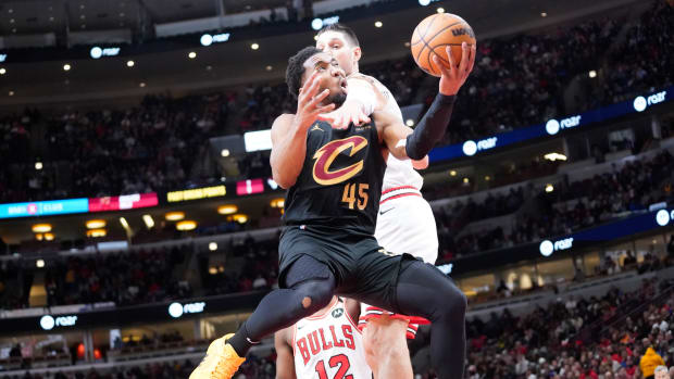 Chicago Bulls center Nikola Vucevic (9) defends Cleveland Cavaliers guard Donovan Mitchell (45) during the second half at United Center in Chicago on Feb. 28, 2024.