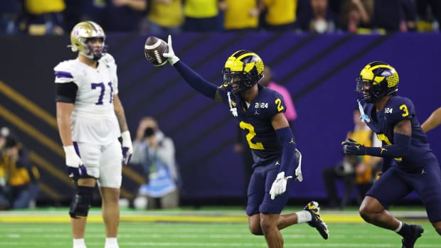 Michigan Wolverines defensive back Will Johnson (2) celebrates with defensive back Keon Sabb (3) after a turnover against the Washington Huskies during the third quarter in the 2024 College Football Playoff