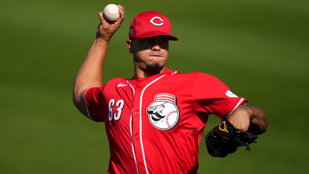 Cincinnati Reds relief pitcher Fernando Cruz (63) long tosses during spring training workouts, Friday, Feb. 16, 2024, at the team s spring training facility in Goodyear, Ariz.  