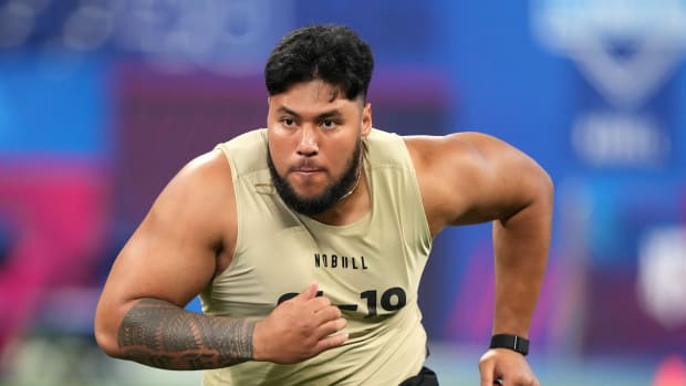 Mar 3, 2024; Indianapolis, IN, USA; Washington offensive lineman Troy Fautanu (OL19) during the 2024 NFL Combine at Lucas Oil Stadium. Mandatory Credit: Kirby Lee-USA TODAY Sports  