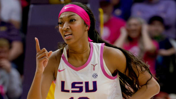 LSU forward Angel Reese reacts to making a basket.