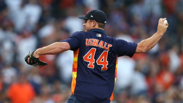 Oct 20, 2022; Houston, Texas, USA; Former Houston Astros pitcher Roy Oswalt throws out the ceremonial first pitch before game two of the ALCS against the New York Yankees for the 2022 MLB Playoffs at Minute Maid Park. Mandatory Credit: Thomas Shea-USA TODAY Sports
