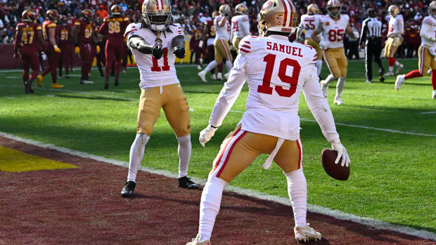 Dec 31, 2023; Landover, Maryland, USA; San Francisco 49ers wide receiver Deebo Samuel (19) celebrates with wide receiver Brandon Aiyuk (11) after scoring a touchdown against the Washington Commanders during the first half at FedExField. Mandatory Credit: Brad Mills-USA TODAY Sports