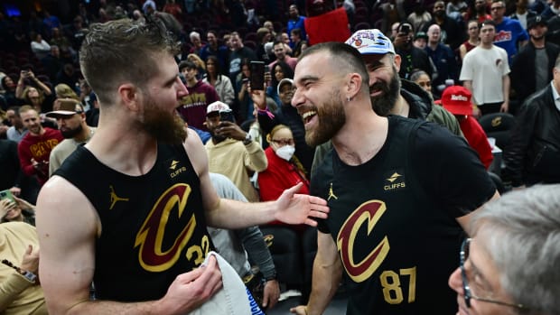Cleveland Cavaliers’ Dean Wade and Kansas City Chiefs tight end Travis Kelce.