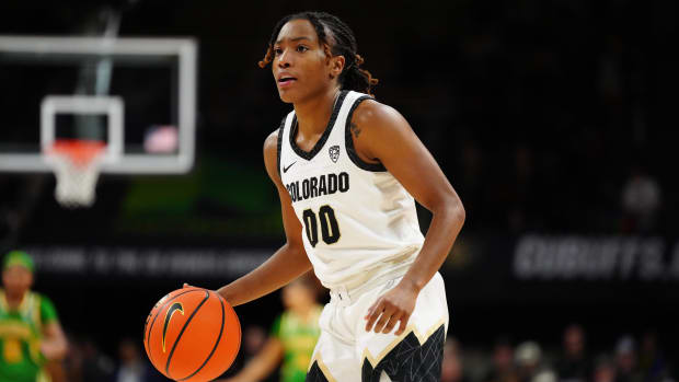 Colorado Buffaloes guard Jaylyn Sherrod (00) controls the ball in the second half against the Oregon Ducks at CU Events Center