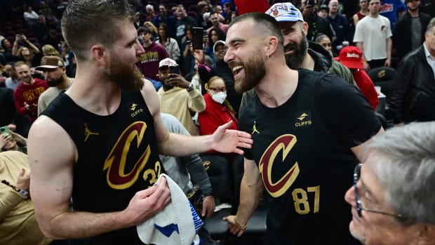 Mar 5, 2024; Cleveland, Ohio, USA; Cleveland Cavaliers forward Dean Wade, left, celebrates with Kansas City Chiefs tight end and Cleveland native Travis Kelce after the Cavaliers beat the Boston Celtics during the second half at Rocket Mortgage FieldHouse. Mandatory Credit: Ken Blaze-USA TODAY Sports