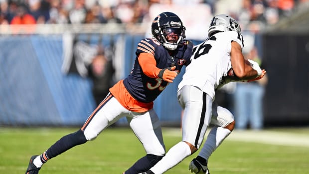 Jaylon Johnson reaches out for the tackle against the Raiders. According to reports, he'll be tagged by the Bears while contract talks continue.