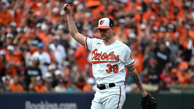 Oct 7, 2023; Baltimore, Maryland, USA; Baltimore Orioles starting pitcher Kyle Bradish (39) reacts after the last out of the top of the first inning was recorded against the Texas Rangers during game one of the ALDS for the 2023 MLB playoffs at Oriole Park at Camden Yards. Mandatory Credit: Tommy Gilligan-USA TODAY Sports