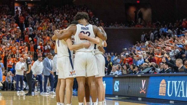 Virginia Cavaliers starting players huddle together during a time-out in the first half of the game against the North Carolina Tar Heels at John Paul Jones Arena.