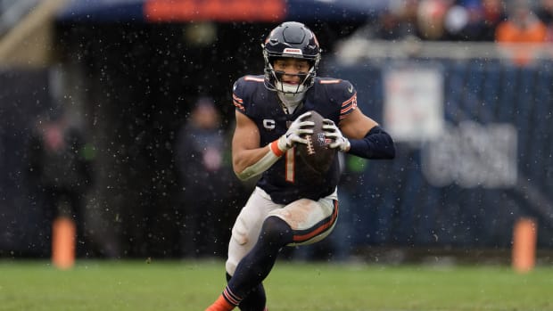 Dec 31, 2023; Chicago, Illinois, USA; Chicago Bears quarterback Justin Fields (1) runs with the ball against the Atlanta Falcons at Soldier Field.