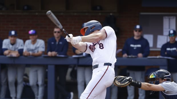 Casey Saucke hits an RBI single during the Virginia baseball game against Penn State at Disharoon Park.