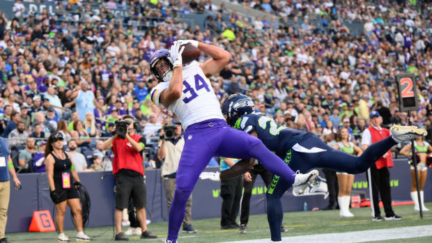Aug 10, 2023; Seattle, Washington, USA; Minnesota Vikings tight end Nick Muse (34) catches a pass for a touchdown over Seattle Seahawks cornerback Tre Brown (22) during the first half at Lumen Field.