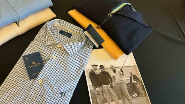 Clothes from the new AD Palmer collection, along with a photo of Arnold Palmer alongside Jack Nicklaus and Sam Snead.