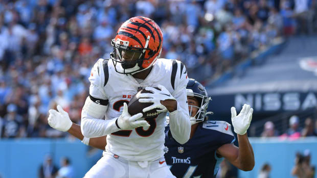 Oct 1, 2023; Nashville, Tennessee, USA; Cincinnati Bengals safety Dax Hill (23) intercepts a pass intended for Tennessee Titans wide receiver Colton Dowell (14) during the second half at Nissan Stadium. Mandatory Credit: Christopher Hanewinckel-USA TODAY Sports  