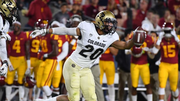 Oct 13, 2018; Los Angeles, CA, USA; Colorado Buffaloes linebacker Drew Lewis (20) celebrates after intercepting a ball on the first pass of the game by USC Trojans quarterback JT Daniels (18) (not pictured) in the first quarter at The Los Angeles Memorial Coliseum. Mandatory Credit: Jayne Kamin-Oncea-USA TODAY Sports  