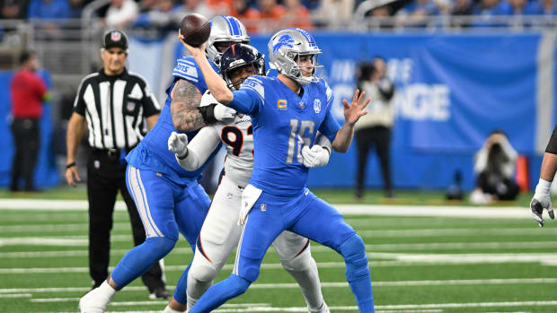 Detroit Lions quarterback Jared Goff (16) throws a pass while being pressured by Denver Broncos defensive tackle Jonathan Harris (92) in the second quarter at Ford Field.