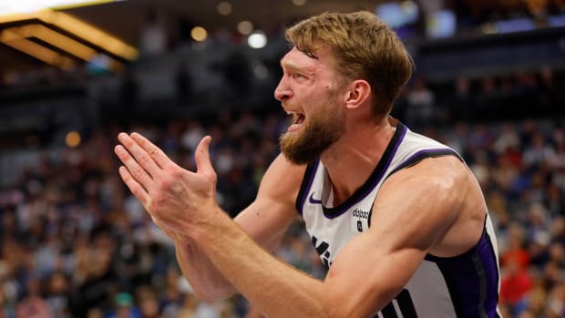 Mar 1, 2024; Minneapolis, Minnesota, USA; Sacramento Kings center Domantas Sabonis (10) asks for a timeout after getting hurt on a play with the Minnesota Timberwolves in the third quarter at Target Center. Mandatory Credit: