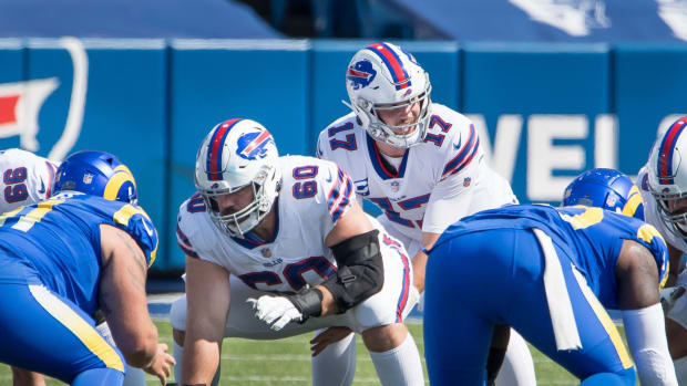 Sep 27, 2020; Orchard Park, New York, USA; Buffalo Bills quarterback Josh Allen (17) at the line of scrimmage with center Mitch Morse (60) in the second quarter of a game against the Los Angeles Rams at Bills Stadium.
