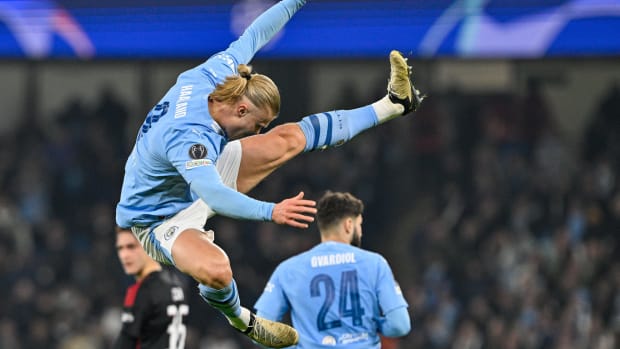 Erling Haaland pictured performing an acrobatic goal celebration after scoring for Manchester City in a 3-1 win over FC Copenhagen in the UEFA Champions League in March 2024