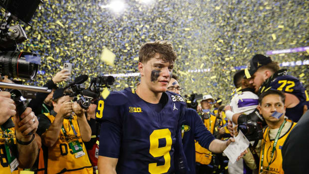 Michigan quarterback J.J. McCarthy celebrates after the 34-13 win over Washington to win the national championship game at NRG Stadium in Houston on Monday, Jan. 8, 2024.