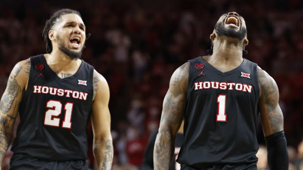 Mar 2, 2024; Norman, Oklahoma, USA; Houston Cougars guard Jamal Shead (1) and guard Emanuel Sharp (21) celebrate after Jamal scored a basket against the Oklahoma Sooners during the second half at Lloyd Noble Center.