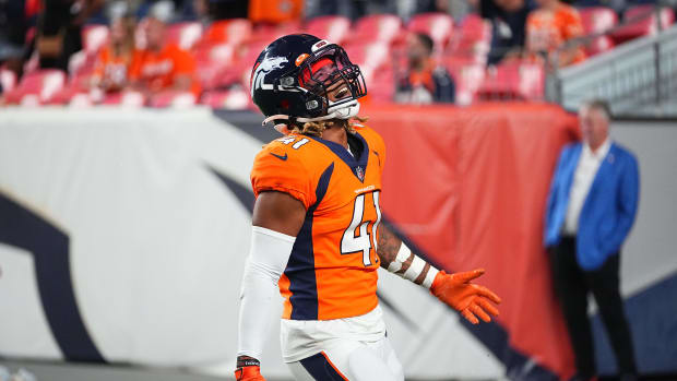 Aug 28, 2021; Denver, Colorado, USA; Denver Broncos safety Jamar Johnson (41) celebrates after defeating the Los Angeles Rams following a preseason game at Empower Field at Mile High. Mandatory Credit: Ron Chenoy-USA TODAY Sports  