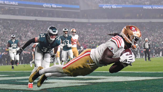 Dec 3, 2023; Philadelphia, Pennsylvania, USA; San Francisco 49ers wide receiver Brandon Aiyuk (11) catches touchdown pass against Philadelphia Eagles safety Reed Blankenship (32) during the second quarter at Lincoln Financial Field. Mandatory Credit: Eric Hartline-USA TODAY Sports  