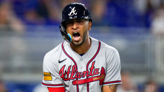 Sep 17, 2023; Miami, Florida, USA; Atlanta Braves outfielder Eddie Rosario (8) reacts to being hit by a pitch from Miami Marlins starting pitcher Jesus Luzardo (not pictured) during the fourth inning at loanDepot Park.