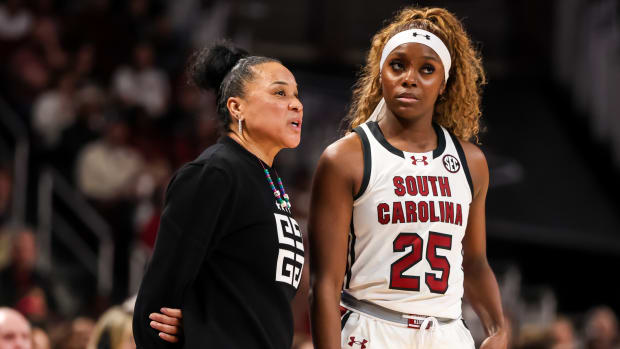 South Carolina Gamecocks head coach Dawn Staley speaks with guard Raven Johnson.