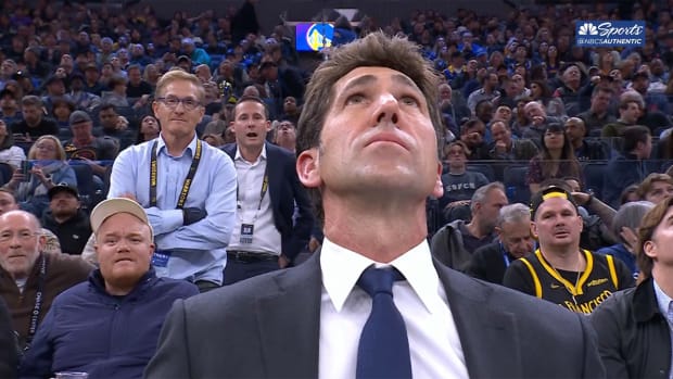 Bob Myers watches his tribute video at Chase Center.