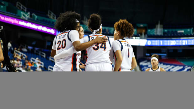 The Virginia women's basketball team huddles during its game against Wake Forest in the first round of the 2024 ACC Women's Basketball Tournament at Greensboro Coliseum.