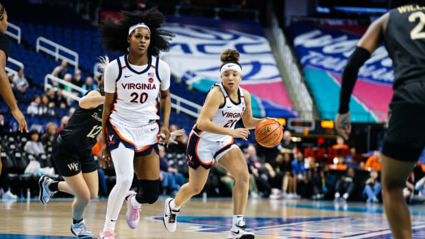 Kymora Johnson handles the ball during the Virginia women's basketball game against Wake Forest in the first round of the 2024 ACC Women's Basketball Tournament at Greensboro Coliseum.