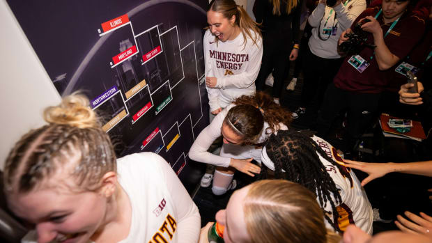 The Gophers celebrate after defeating Rutgers in the first round of the Big Ten Women's Basketball Tournament.