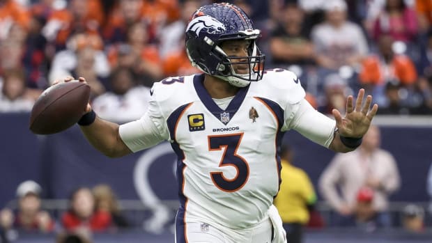 Broncos quarterback Russell Wilson throws a pass in a game.