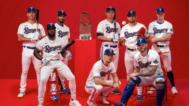 The Texas Rangers revealed their gold-trimmed World Series championship uniforms and caps in a series of social media posts on Thursday. The jerseys and caps will be available to fans on March 21.