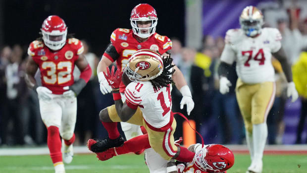 Feb 11, 2024; Paradise, Nevada, USA; Kansas City Chiefs safety Mike Edwards (21) tackles San Francisco 49ers wide receiver Brandon Aiyuk (11) during overtime of Super Bowl LVIII at Allegiant Stadium. Mandatory Credit: Kirby Lee-USA TODAY Sports  