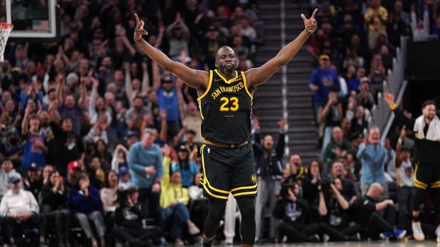 Golden State Warriors forward Draymond Green (23) reacts after making a three point basket against the Milwaukee Bucks in the fourth quarter at the Chase Center.