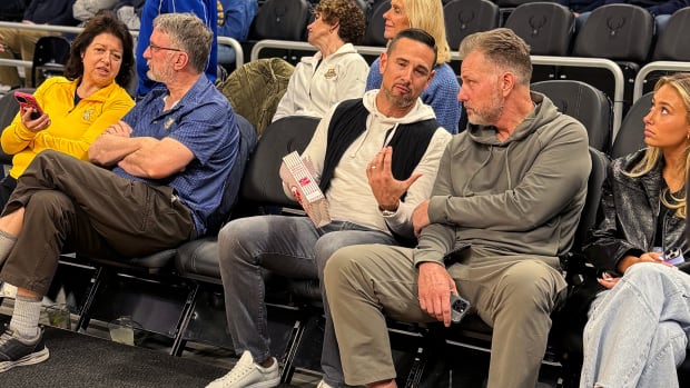 Matt LaFleur and Matt Eberflus meet up at the Marquette-UConn game. Eberflus was reportedly in Milwaukee because his daughter was visiting Marquette.