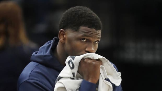 Feb 28, 2024; Minneapolis, Minnesota, USA; Minnesota Timberwolves guard Anthony Edwards (5) awaits his turn to return to the game against the Memphis Grizzlies in the fourth quarter at Target Center.