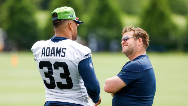Seattle Seahawks strong safety Jamal Adams (33) talks with general manager John Schneider during minicamp practice at the Virginia Mason Athletic Center Field.